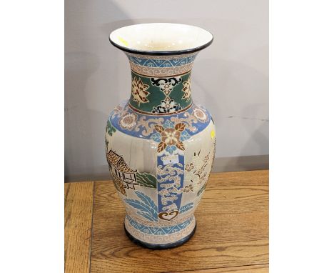 Oriental ceramic vase decorated with buildings and flowers, 55 cm