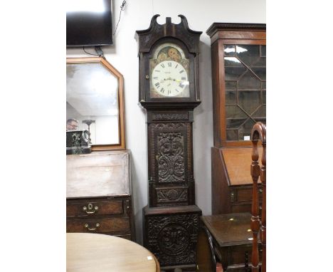 Heavily carved oak longcase clock with paint face and eight day movement, height 228 cm, width 55 cm, depth 26 cm