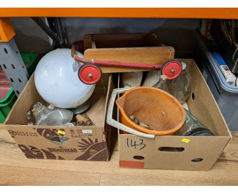 Two boxes of light fittings, doorknobs, child's trolley and stoneware hot water bottles 