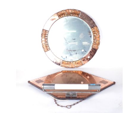 AN ART DECO WALL MIRROR OF HEXAGONAL FORMwith peach glass mirror plate and fitted light 68cm wide; 55cm high together with a 