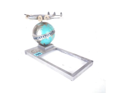 AIR FRANCE, A MID 20TH CENTURY DESKTOP NOTEPAD HOLDER WITH GLOBE AND PLANE13cm wide; 25cm deep