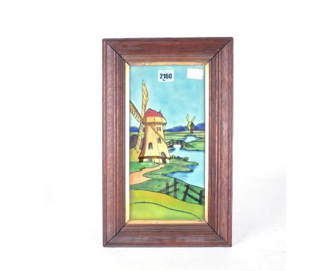 A MID 20TH CENTURY FRAMED RECTANGULAR TILE OF A  DUTCH WINDMILL25cm; 40cm