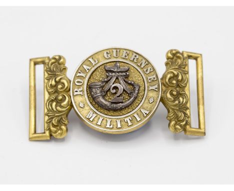 A rare Royal Guernsey Militia belt buckle, for the 2nd Battalion, two piece interlocking buckle, each section with scrolling 