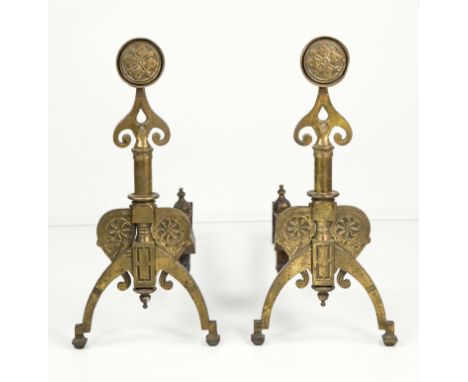 A pair of Aesthetic Movement bronze fire dogs or andirons, circa 1880, roundel and spear tip finials into cylinder form colum