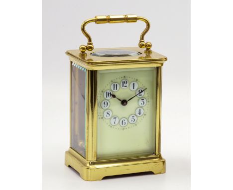 A French single train, brass cased carriage clock, early 20th century, the very pale green enamel dial with Arabic numerals s
