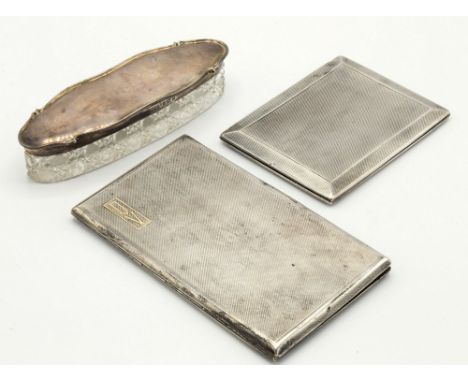 Two silver cigarette cases by Asprey, both with engine turned design, the larger, London 1939, initialled to the front, openi