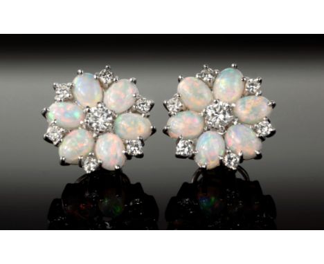 A fine pair of 18ct white gold, opal and diamond floral cluster earrings, the six oval cabochon opals divided by brilliant cu