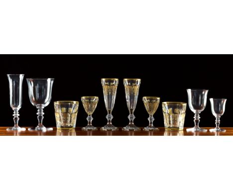 A part suite of Baccarat Empire pattern glasses, comprising ten champagne flutes, eight tumblers and two liqueur glasses, all