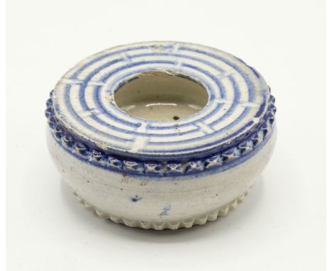 A Chinese Ming period heavy porcelain inkpot or inkwell, 15th / early 16th century, of shallow drum form with bands of raised