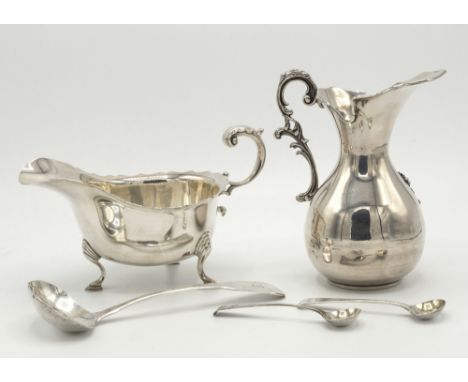 An Elizabeth II silver sauce boat, Walker & Hall, Birmingham 1990, typical Georgian form with cut card rim, foliate capped fl