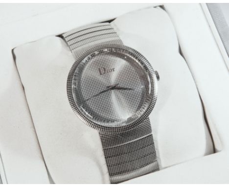A Christian Dior La D de Dior wristwatch, c.2009, model no. CD043110, case no. EB6508, with 38mm. chequer engraved stainless 