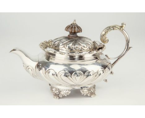 A rare late Georgian silver and parcel gilt saffron teapot, unmarked, hinged domed gadrooned lid with conforming carved woode