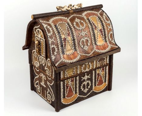 An Indonesian house shaped box, in vernacular style, late 19th / early 20th century, bamboo construction, carved bone and she