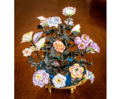 A Sevres style table centrepiece, 19th century, blue porcelain bowl with gilt reserves infilled with floral sprigs, within an