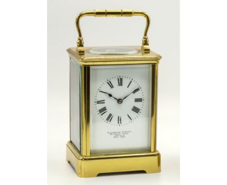 A large French lacquered brass carriage clock, retailed by Goldsmiths' Company, 112 Regent Street, London W, the corniche cas