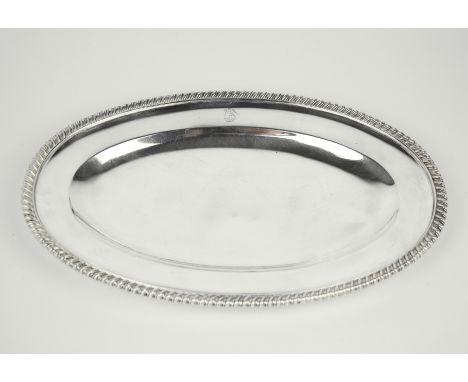 A William IV silver oval dish by Paul Storr, London 1837, with gadrooned rim and engraved crest, Out of a ducal coronet a fal