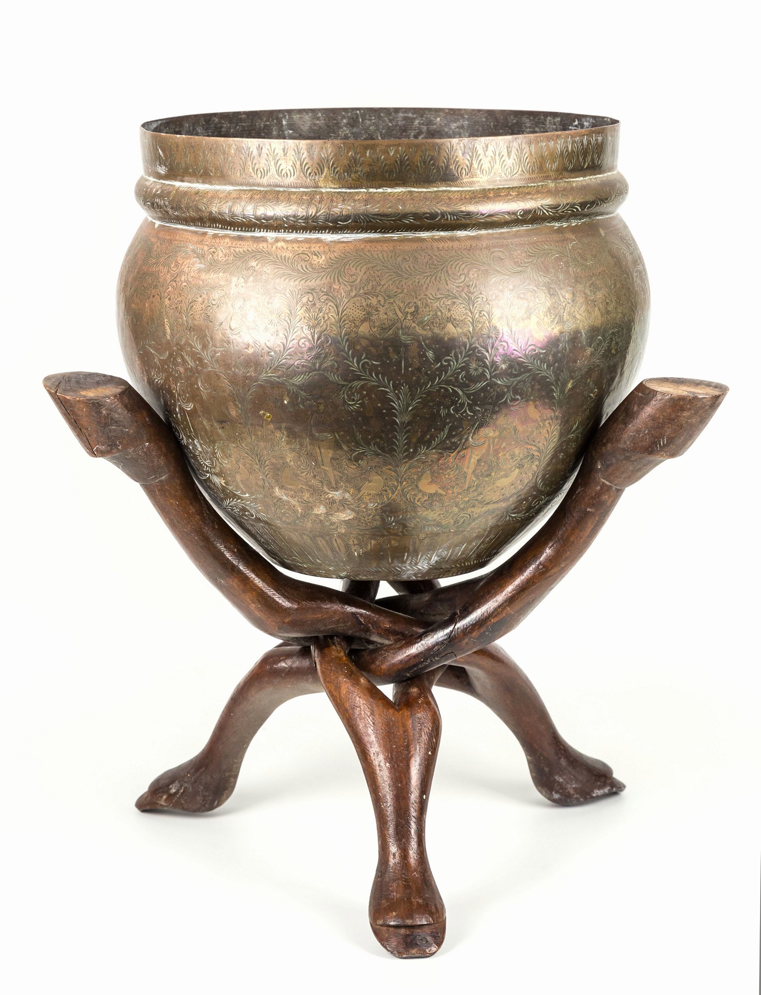 A large Indian brass bowl on a folding wooden stand, late 19th / early