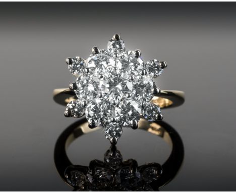 An 18ct yellow gold and diamond floral cluster ring, the thirteen brilliant cut diamonds of good clarity and colour in a six 