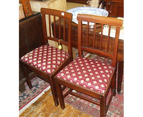 Pair of 19th c. mahogany dining chairs with top rail above stick splats and upholstered drop in seats