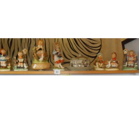 Group of Hummel type figures (7), and a Victorian butter dish
