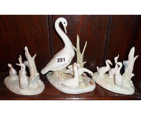 Pair of Nao Lladro swan ornaments and another larger by Casades