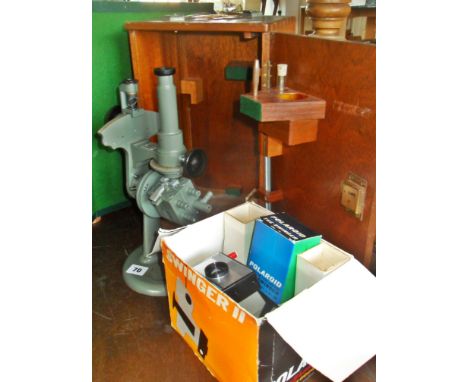 A Hilger & Watts microscope in wooden case and a Swinger 2 Polaroid camera (boxed)