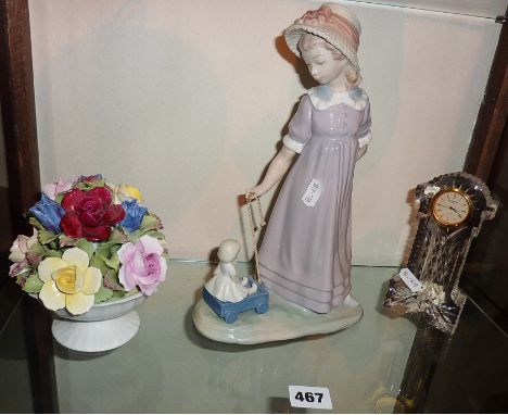 Lladro figurine of a girl with dolly in cart, a Waterford crystal 'grandfather clock' and an Aynsley china flower basket