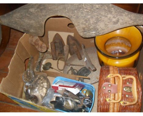 Box of assorted metalware, inc. cast iron boot scraper, flat irons, tools and an old wooden yoke