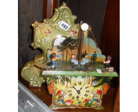 Painted wood mechanical toy cuckoo clock and a ceramic mantle clock
