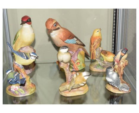 Six Royal Worcester porcelain bird figurines comprising: Woodpecker 3249, Jay 3248, Blue Tits 3375, Coal Tits 3376, Pied Wood