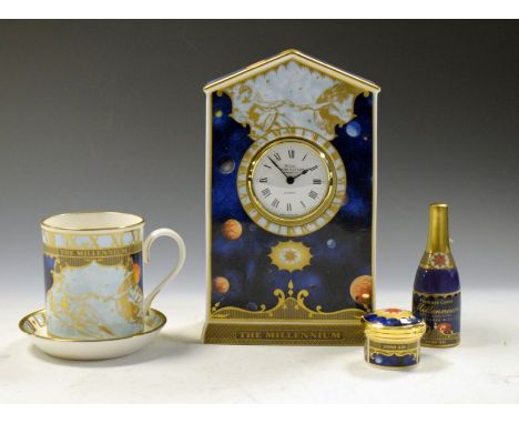 Royal Worcester porcelain Millennium Collection mantel clock, champagne bottle candle snuffer, mug and coaster, and snuff/pil