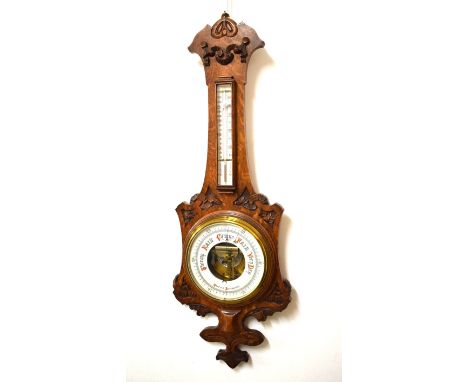 Late 19th/early 20th Century oak cased aneroid barometer having mercury thermometer with ceramic register plates, 90cm high  