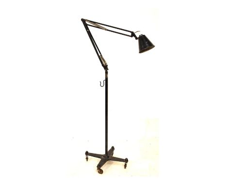 Modern Design - Black-painted iron floor standing adjustable Anglepoise-type lamp on tubular stem and cruciform base with cas