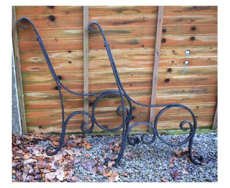 Pair of wrought iron scroll design bench ends  
