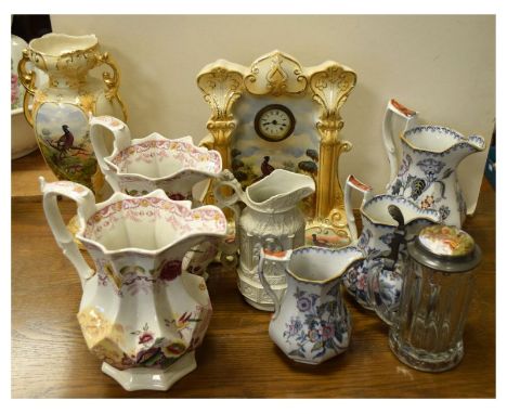Pottery mantel clock, a collection of various 19th Century jugs including a Charles Meigh Gothic salt glaze example, and a gl