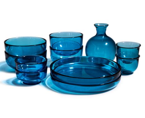 A VENINI MURANO BLUE GLASS TABLEWARE SET
Italy, 11 piece set comprising; a pair of plates, two pairs of bowls, a carafe, pair