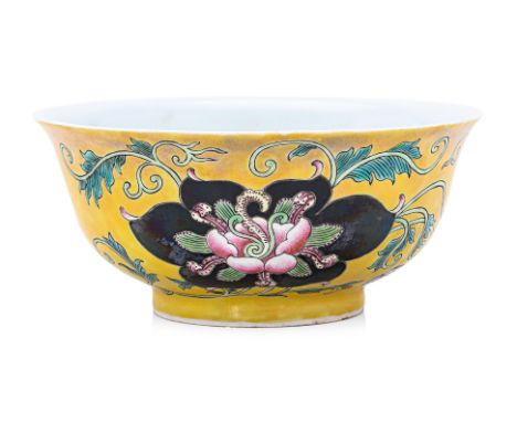 A YELLOW GROUND ENAMEL DECORATED BOWL
Decorated in flowers and flowing vines, two black ground foliate panels, blue four char