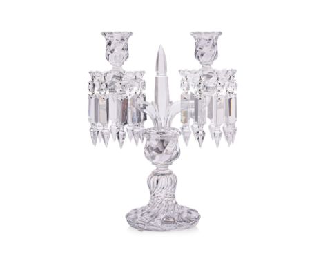 A BACCARAT CRYSTAL TWO LIGHT CANDELABRA
With spirally fluted base, two faceted branches, the conforming sconces and drop pans