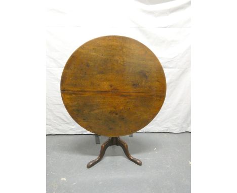 18th century mahogany circular tilt top supper table upon tripod base with pad feet. Height 71cm, Diameter 90cm.