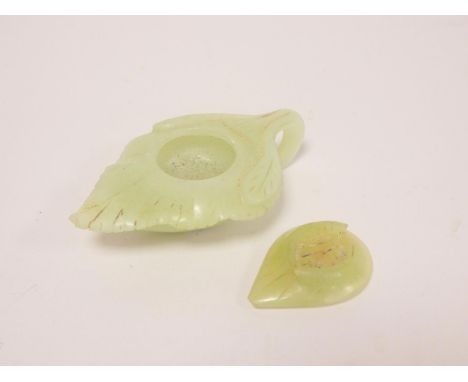 Antique Chinese carved jadeite votive oil lamp of stylised leaf form, complete with cover. Length 10cm.