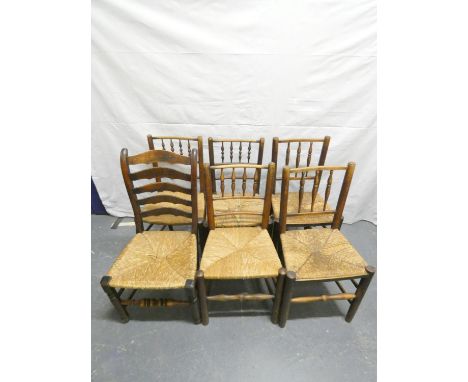 Six antique oak and elm rush seated near matching country chairs, five with bobbin turned backrests, the other with ladder ba