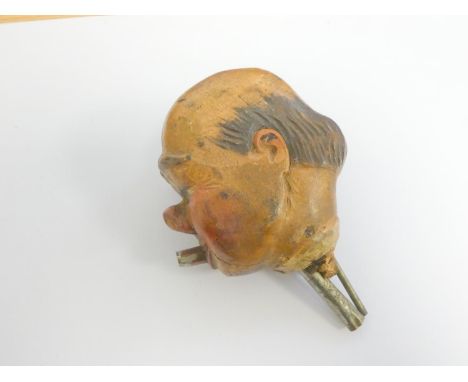 Early 20th century Black Forest carved wooden clockwork character bottle stopper / pourer playing a tune when angled downward