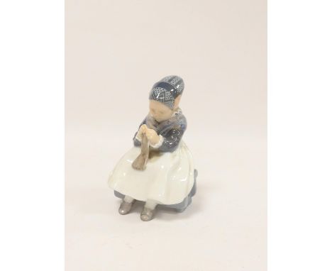 Royal Copenhagen. Porcelain figure of a woman sewing. Model No.1314, H15.5cm.