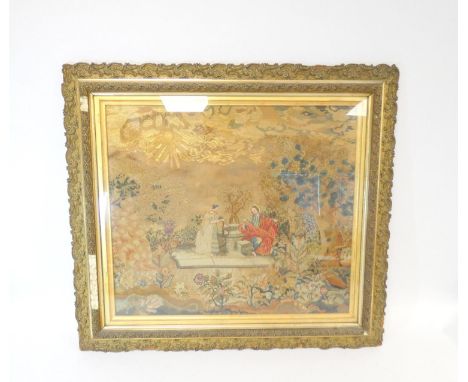 Fine 19th century silk and wool work tapestry depicting Rebecca at the well, in naturalistic surroundings below a sunburst sk