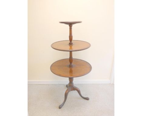 Early 19th century Georgian mahogany three tiered circular dumbwaiter raised on tripod support. The largest base measuring 69