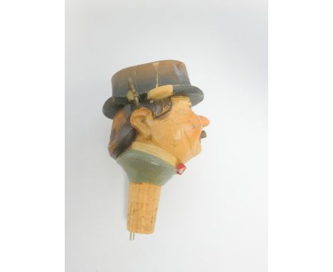 Early 20th century Black Forest carved wooden clockwork character bottle stopper / pourer modelled after an Alpine gentleman,