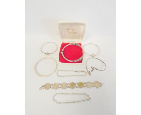Sterling silver bangles and bracelets to include two Pandora examples, a silver coin bracelet, a black onyx Turkish style ban