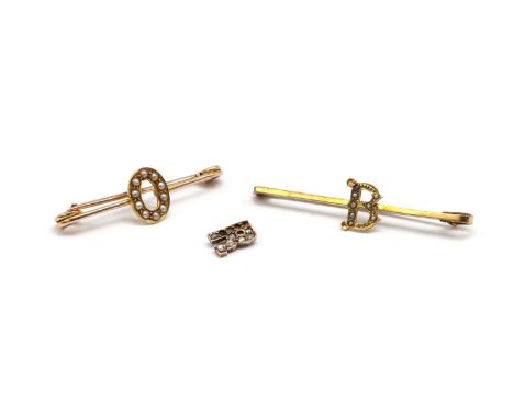 Two gold split pearl set initial brooches, one with a split pearl set 'O' to a safety pin style brooch, the other with a spli