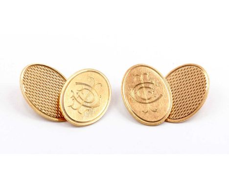 A pair of 9ct gold oval chain link cufflinks, with engine turned decoration to one face, and hand engraved monogram to the ot
