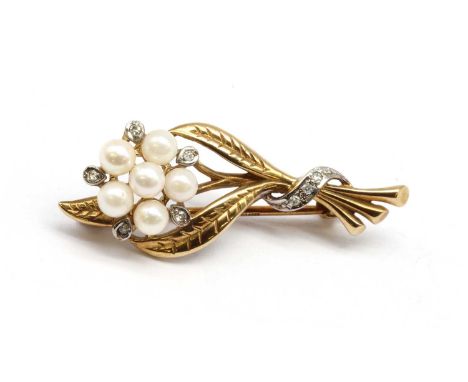 A 9ct gold cultured pearl and diamond spray brooch,with pin and roller catch, London 1985, 3.53gCondition report: Minor surfa